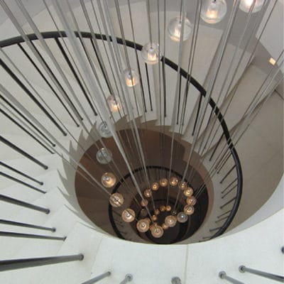 CIRCULAR CANTILEVER STONE STAIRCASE IN PORTLAND LIMESTONE